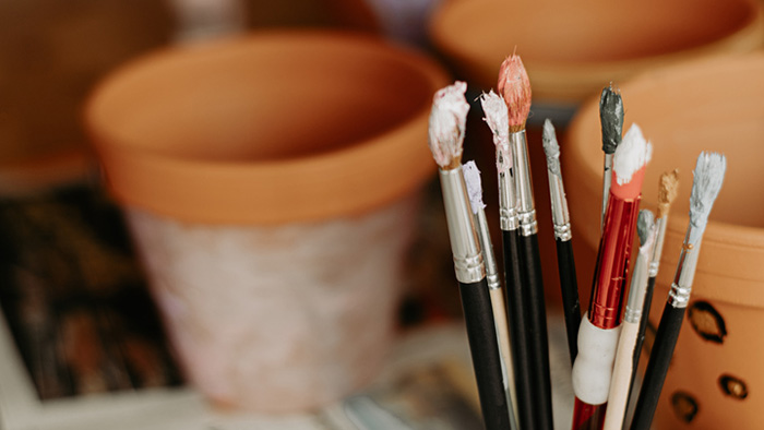 paint brushes in a cup