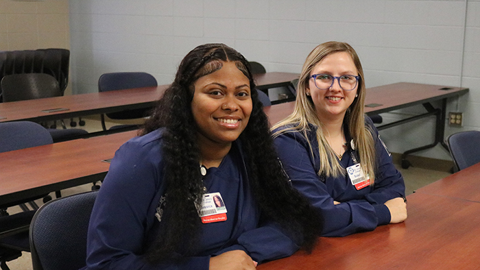 Two female nursing students in classroom