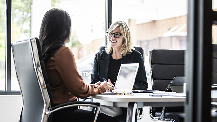Manager speaking with colleague
