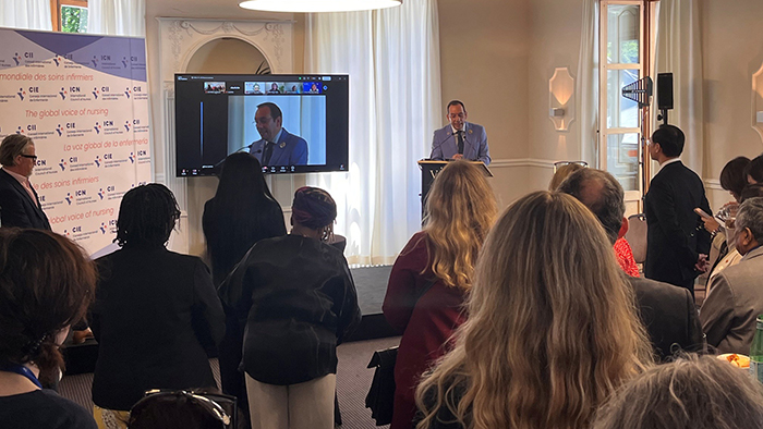 Dr. Cobos Serrano (president of the International Council of Nurses) giving a presentation at a World Health Assembly event in Geneva