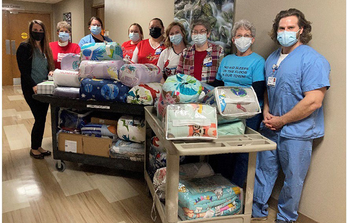 Colleagues collect bedding