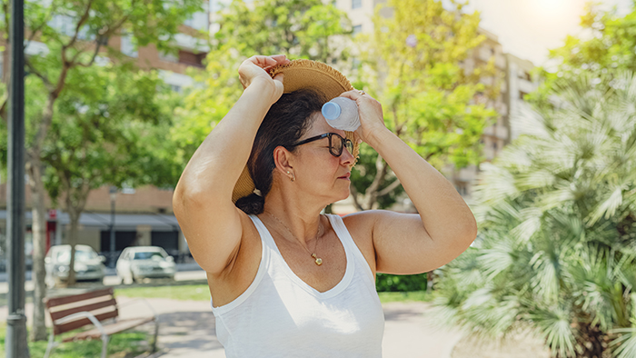 Woman outside in extreme heat