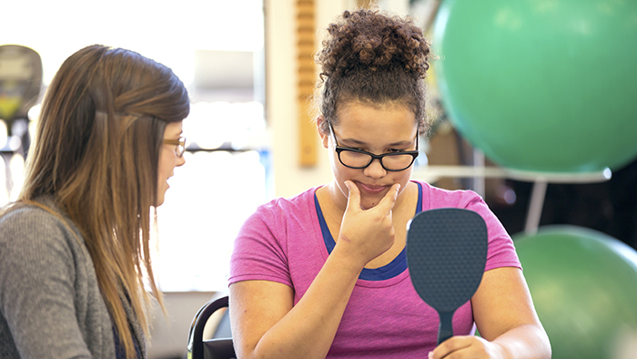 Woman patient working with speech therapist