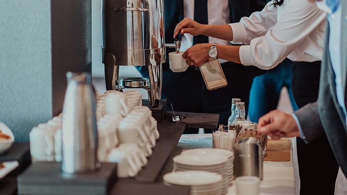 woman pouring coffee
