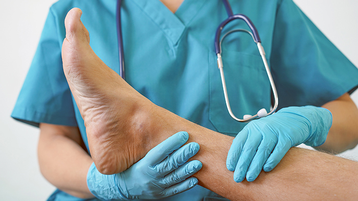 Doctor looking at patients foot and ankle