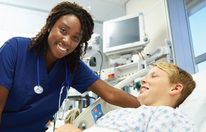 group of emergency care physicians and providers bringing a patient into surgery