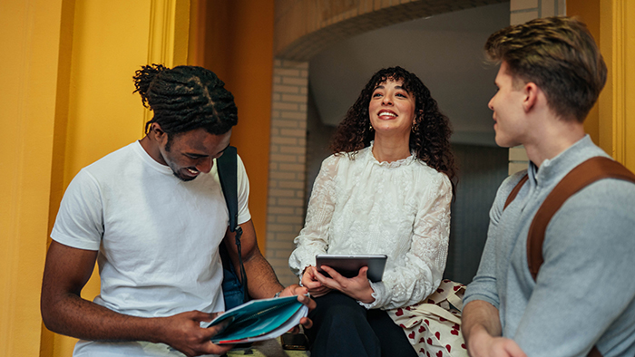 three college students talking