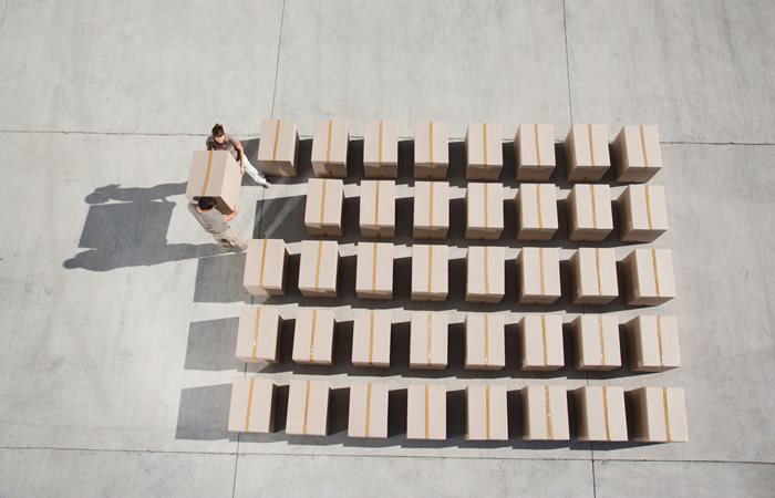 Boxes are organized into a grid pattern on a loading dock