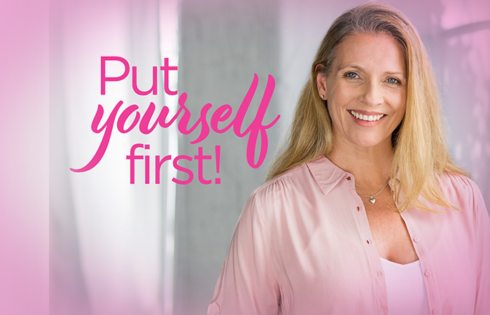 Young woman in pink smiling