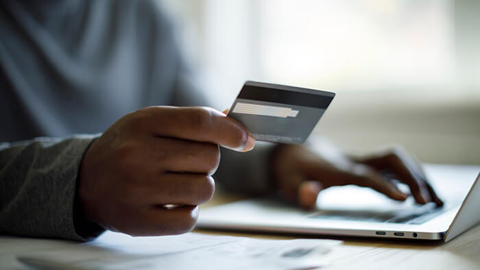 someone holding credit card