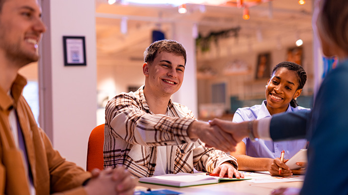 young man shaking hands