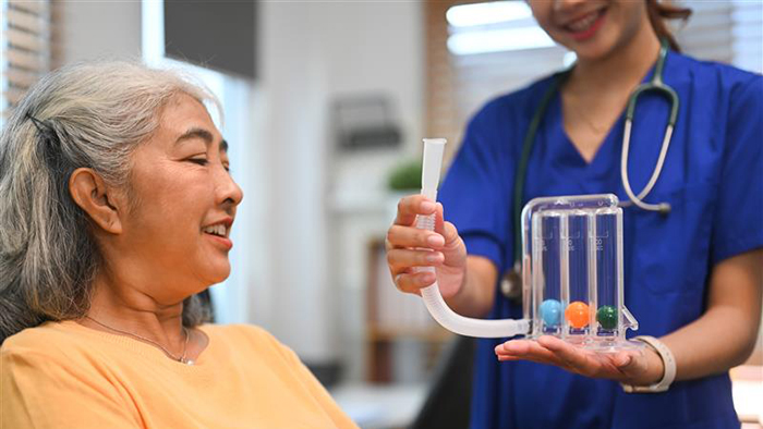 Respiratory therapist demonstrating spirameter