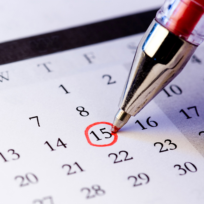 A red pen circles a date on a calendar