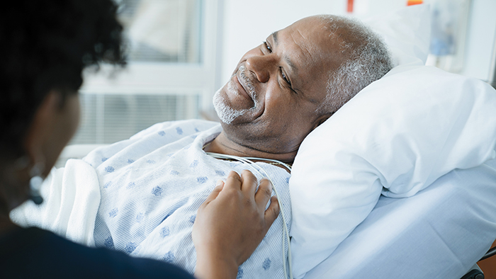 male patient in hospital bed