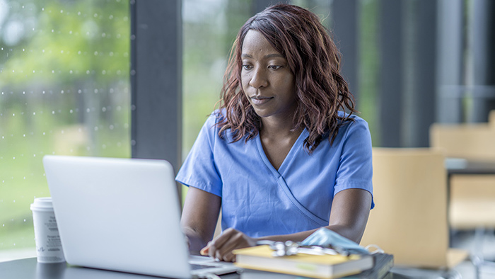 Young nurse student at computer