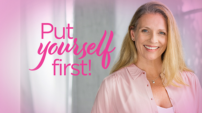 Young woman in pink smiling 