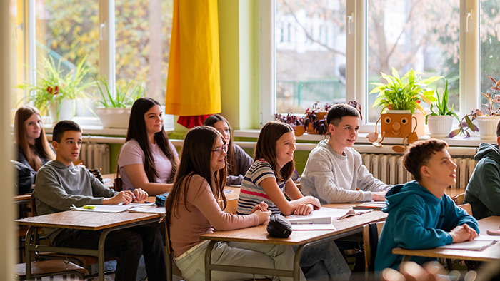 middle school students sitting at their desks