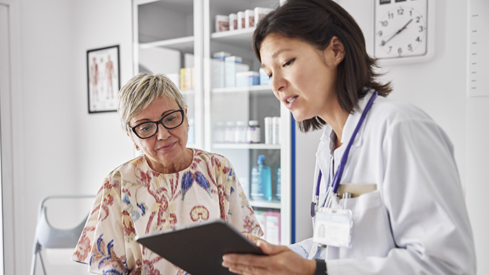 doctor talking with female patient