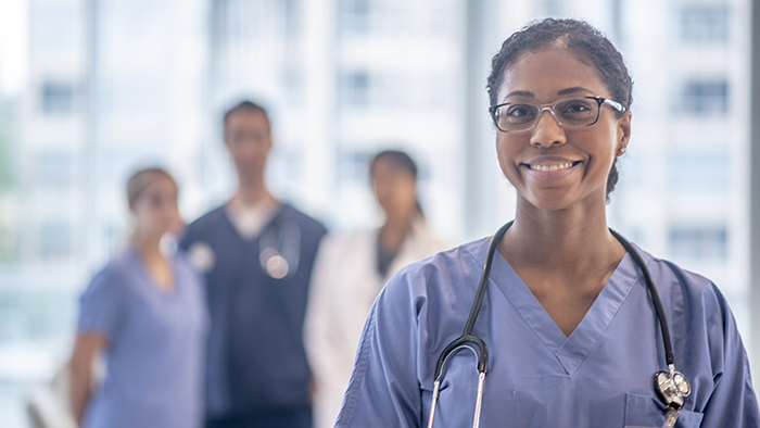 Female nurse leader in front of student nurses