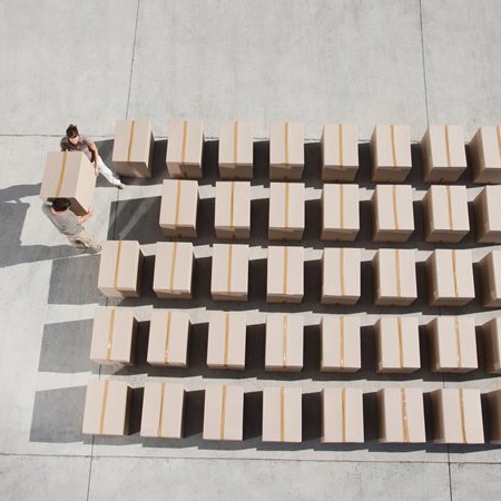 Boxes are organized into a grid pattern on a loading dock