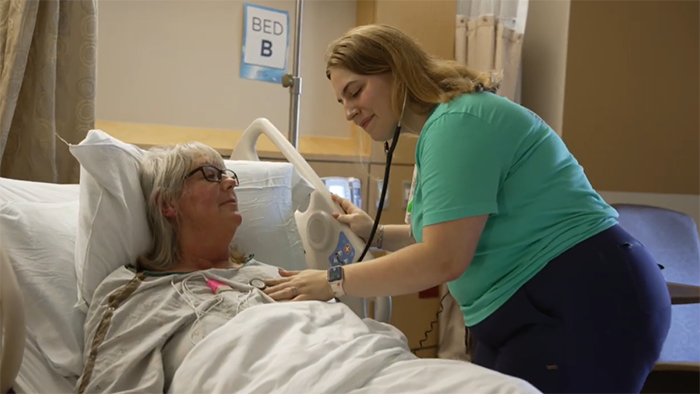 Ally listening to patient's heartbeat