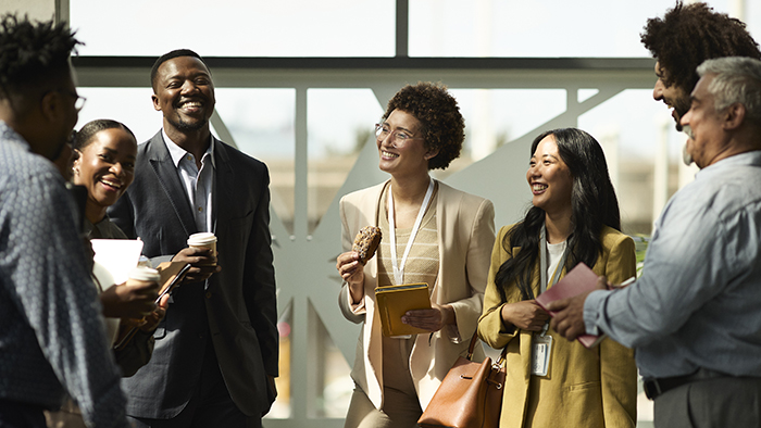 young business professionals talking in a group
