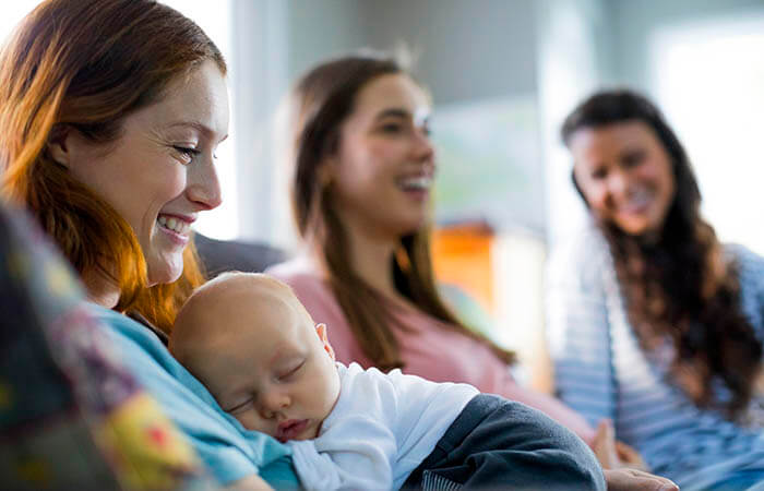 group of diverse women sitting in a support group 