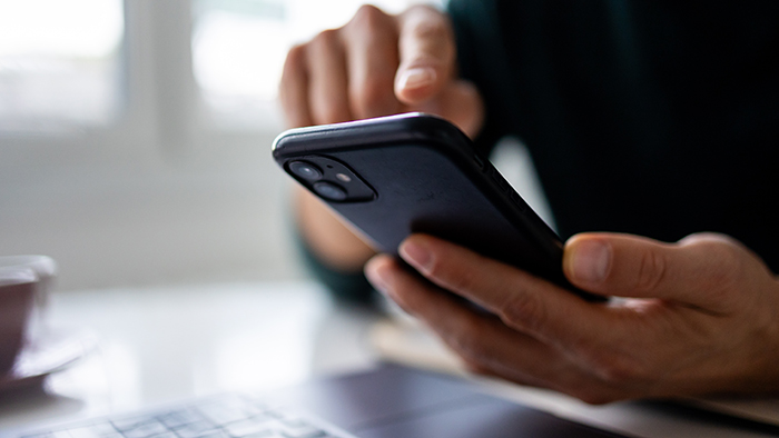 A hand using smart phone