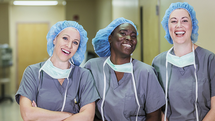 Three surgery nurses smiling
