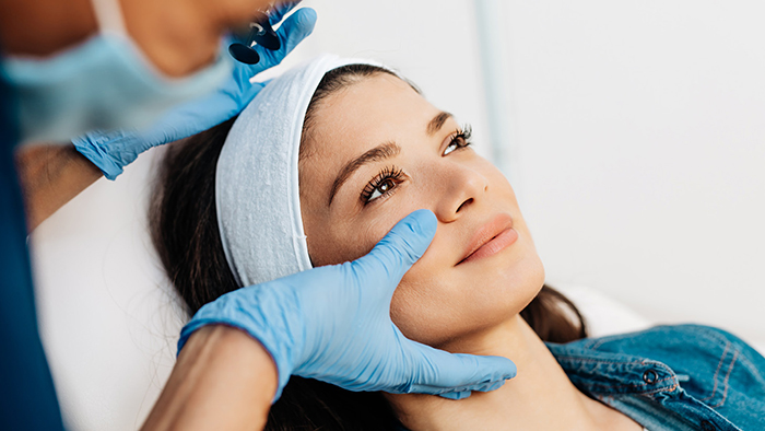 patient receiving facial procedure