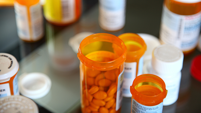 prescription bottles open on table