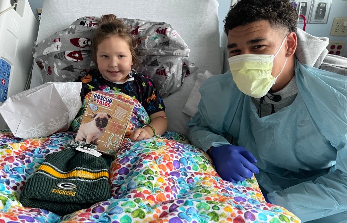 Packers wide receiver Allen Lazard visits with patients at HSHS St. Vincent Children’s Hospital in G