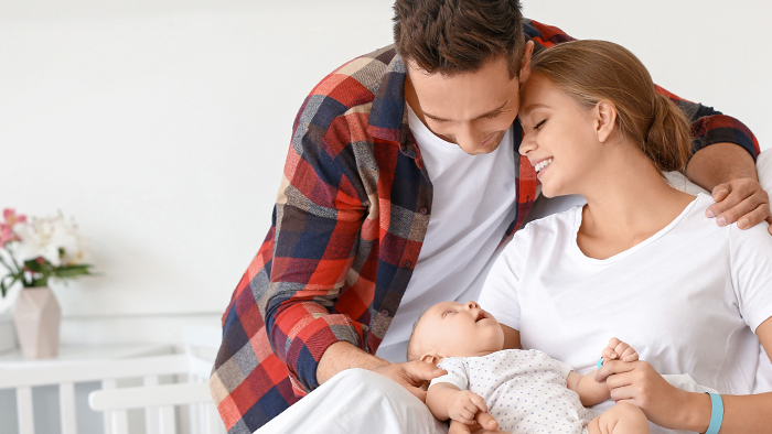 Young couple with newborn baby