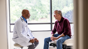 Middle-aged male patient meeting with physician