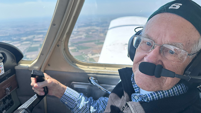 Jerry flying a plane