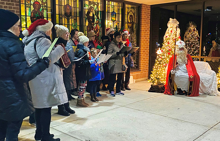 Carolers singing with St Nicholas