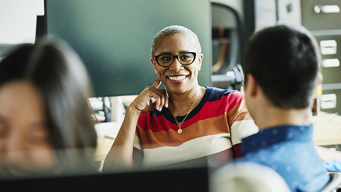 Woman listening to young man speak